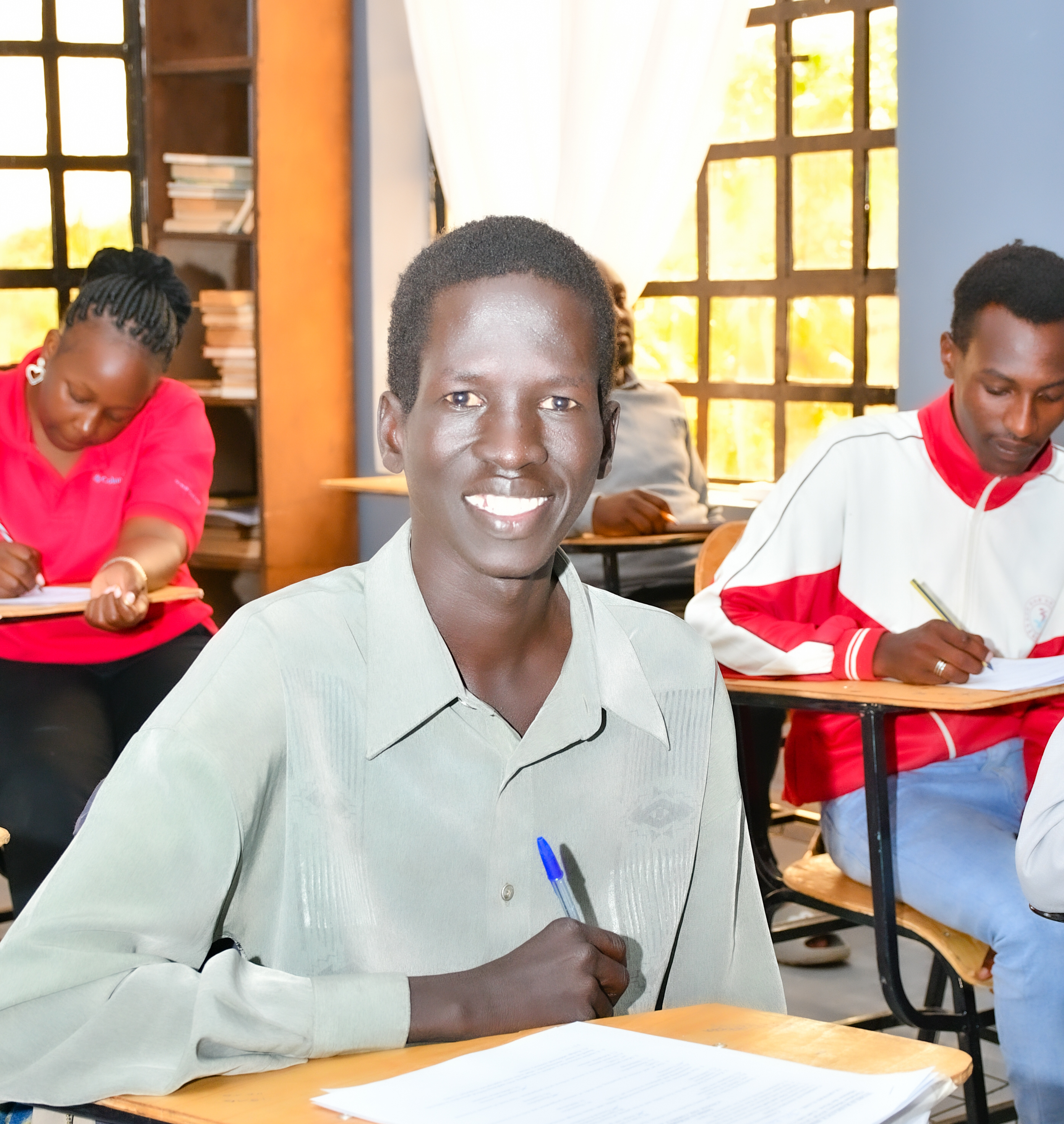 Green double couch with wooden legs