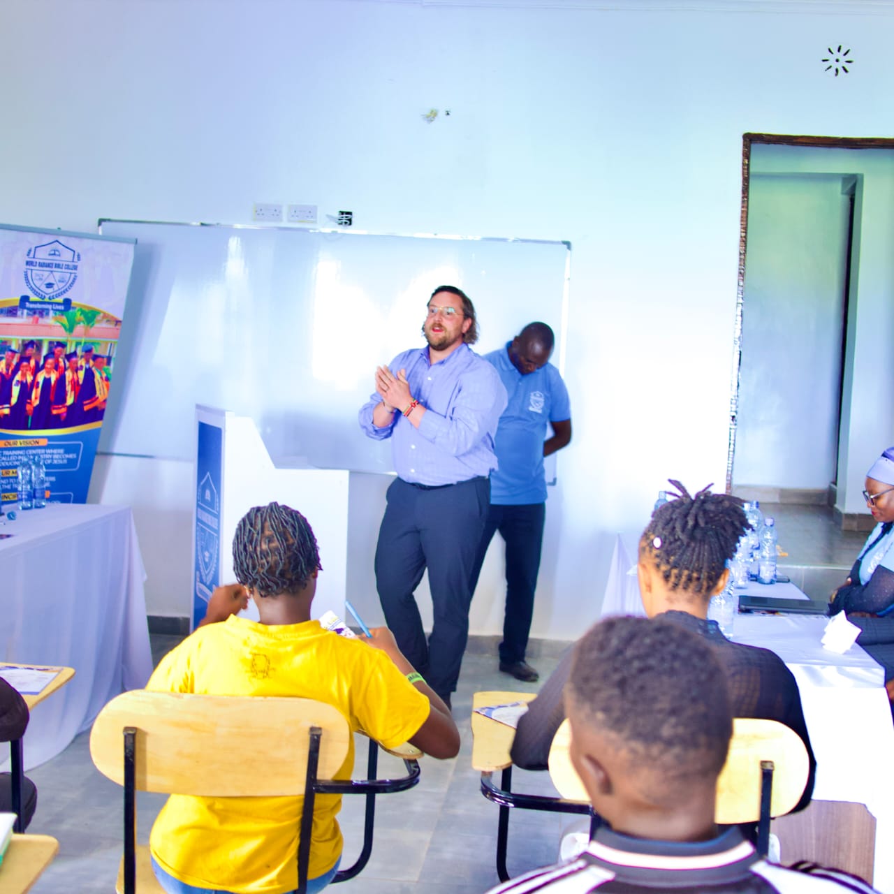 Green double couch with wooden legs